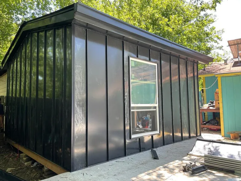 Black standing seam metal wall panels for Roof Inspection in Huntley