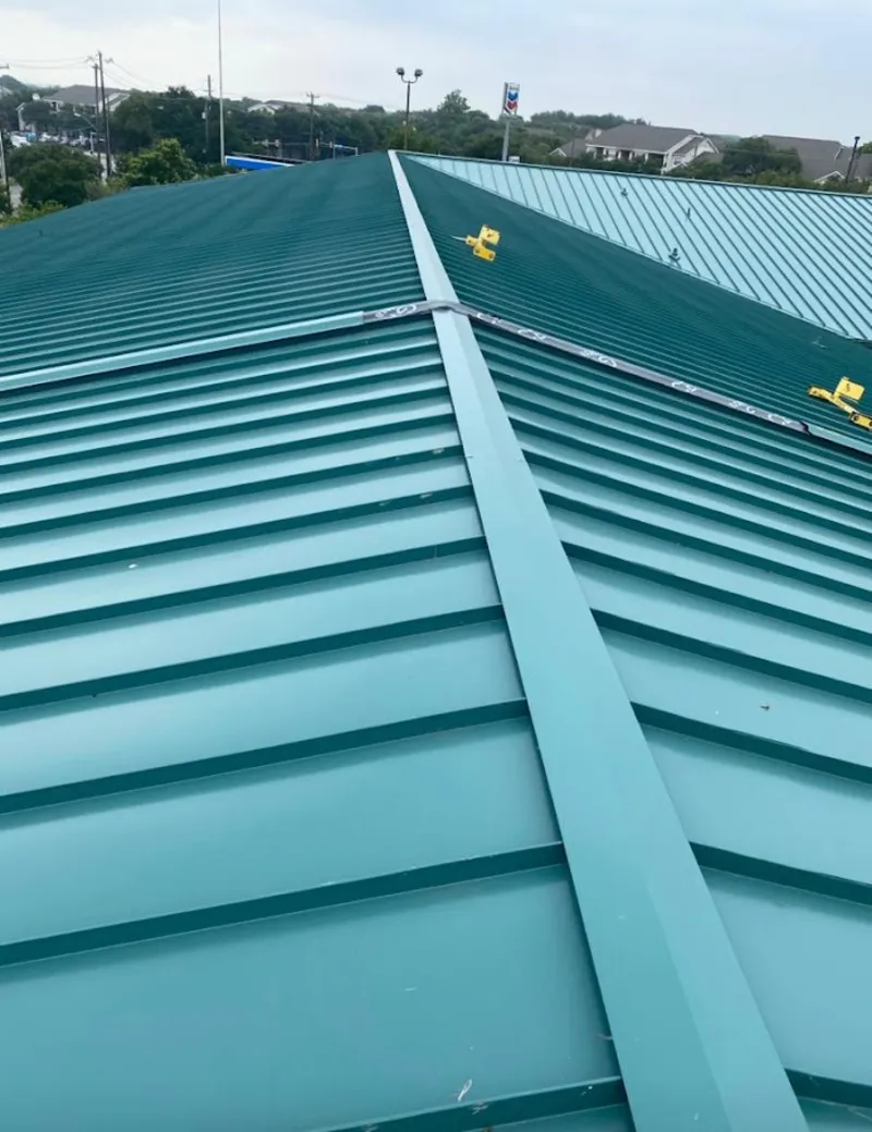 Green commercial metal roof ridge and valley for Metal Roof Repair in Huntley